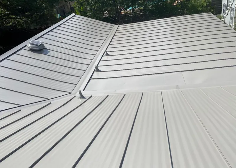 Solar attic fan installed on a metal roof for Roof Ventilation in Gillette